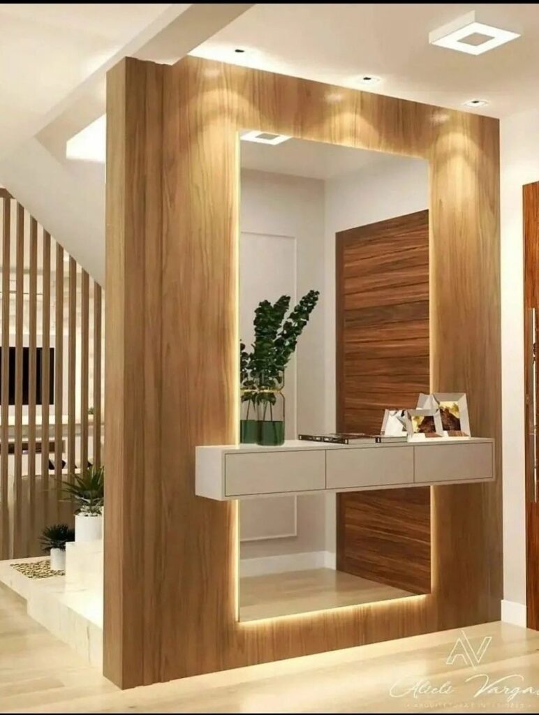 تصميم داخلي لصالة فيلا مودرن فاخرة بحي حطين بالرياض تتميز بجدار من بديل الرخام الأبيض ذي العروق الرمادية مدمج مع إضاءة ليد دافئة وأسقف جبس بورد فلات ناعمة